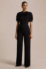 Raquel | Black Asymmetric-Neck Jumpsuit With Twisted Cape Detail